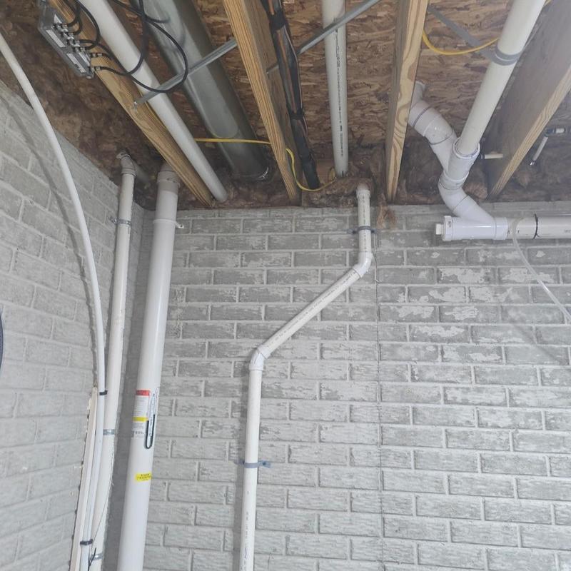 Liberty WaterJet sump pump discharge pipes installed