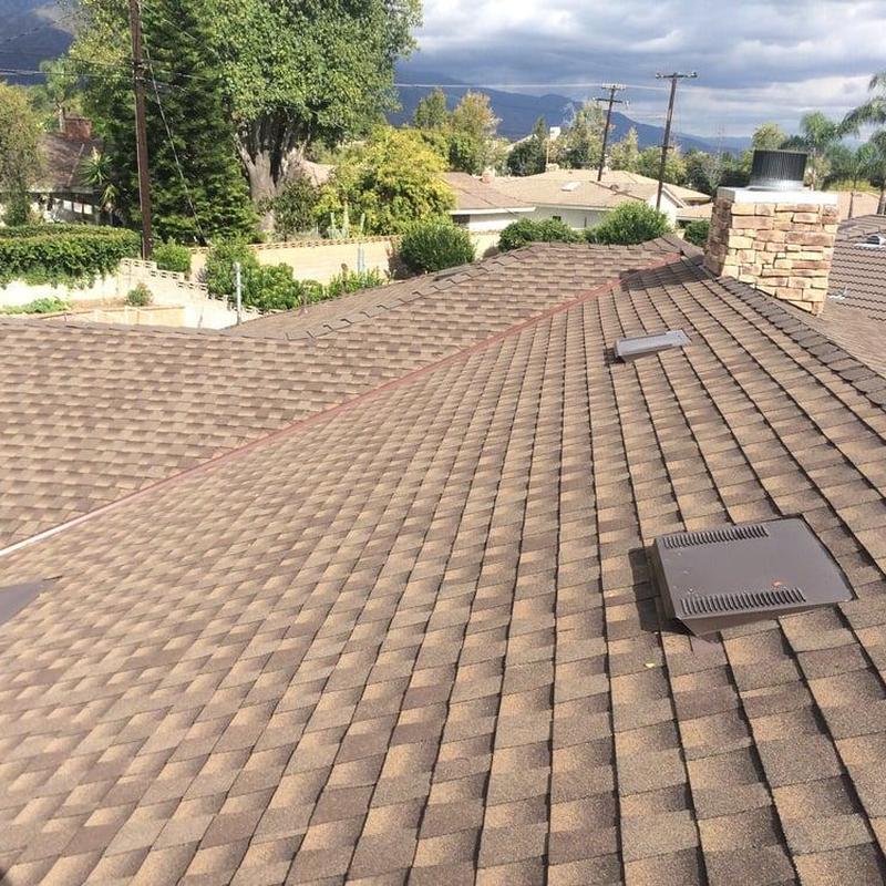 Shingle roof with vents and chimney on residential home Shingle roof with vents and chimney on residential home