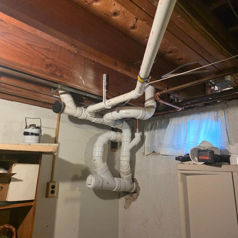 PVC drain pipes with cleanout in basement ceiling PVC drain pipes with cleanout in basement ceiling