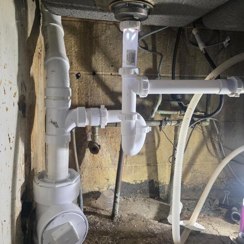 Kitchen sink drain piping with Studor vent installation
