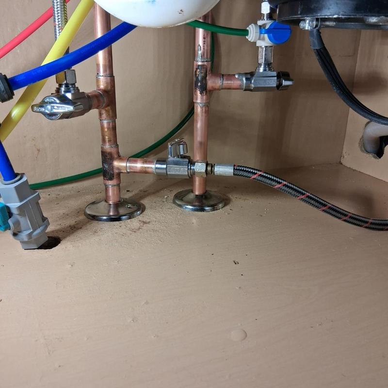 Copper stop valves and piping under sink installation Copper stop valves and piping under sink installation