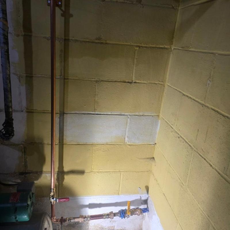 Copper water meter bank with ball valves installed
