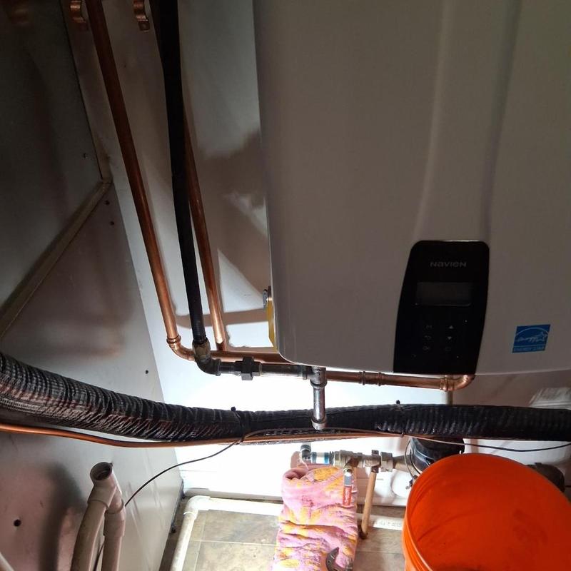 Tankless water heater piping and service valves installation