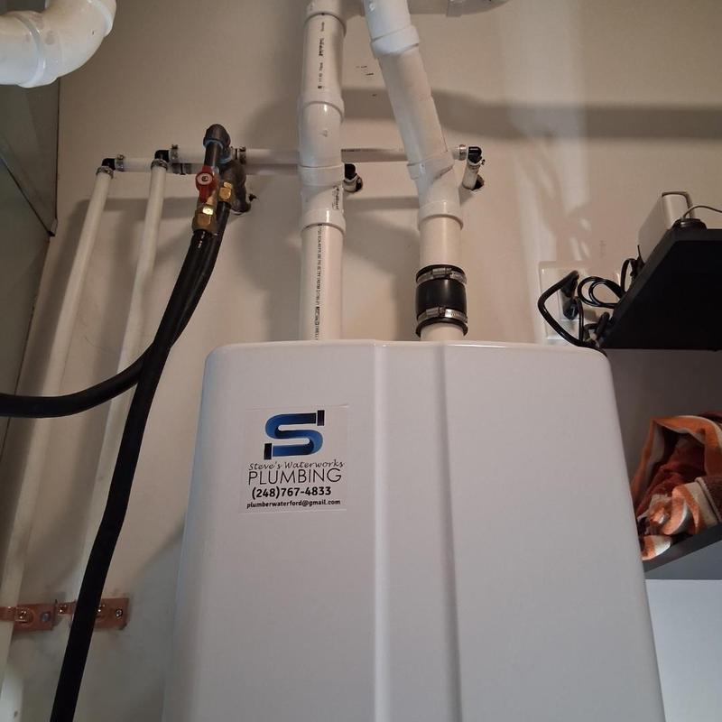 Tankless water heater repipe with service valves