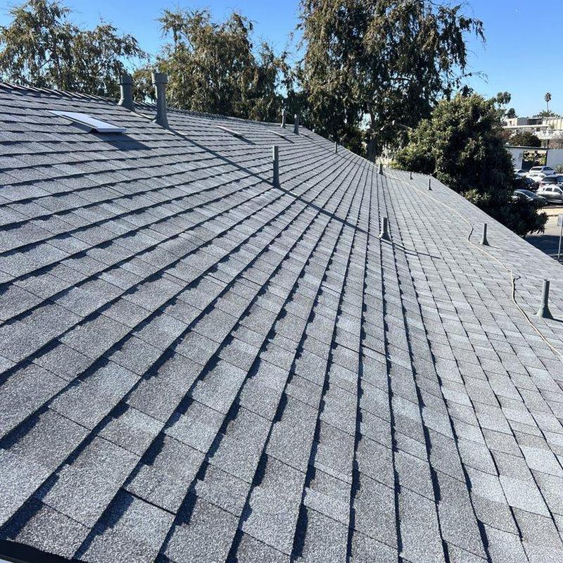 Shingle roof with vents installed on residential building Shingle roof with vents installed on residential building