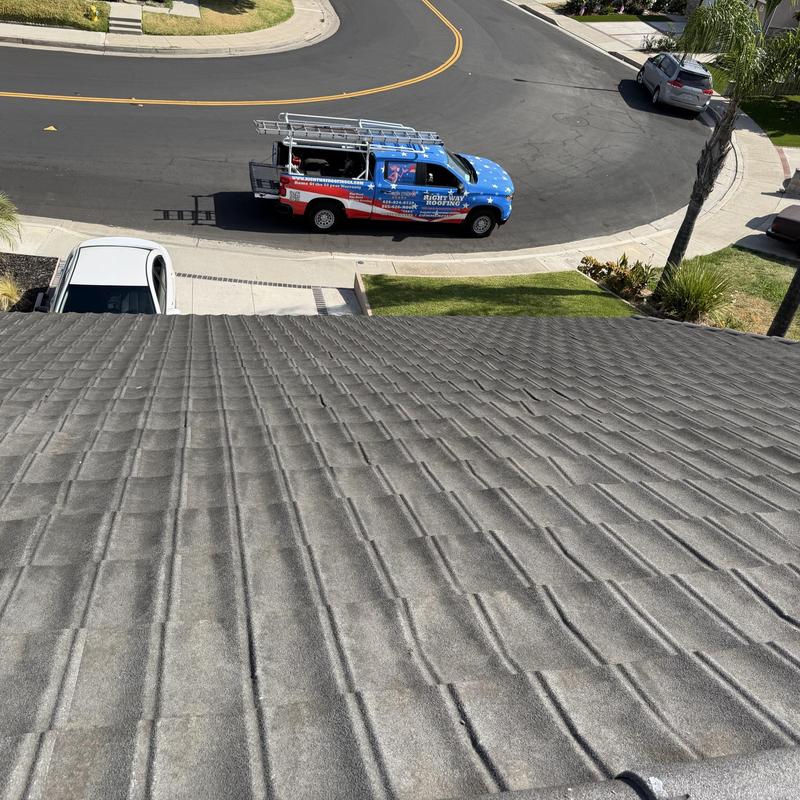 Concrete tile roof inspection with roofing service truck Concrete tile roof inspection with roofing service truck
