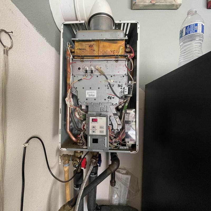 Tankless water heater interior cleaning and debris removal
