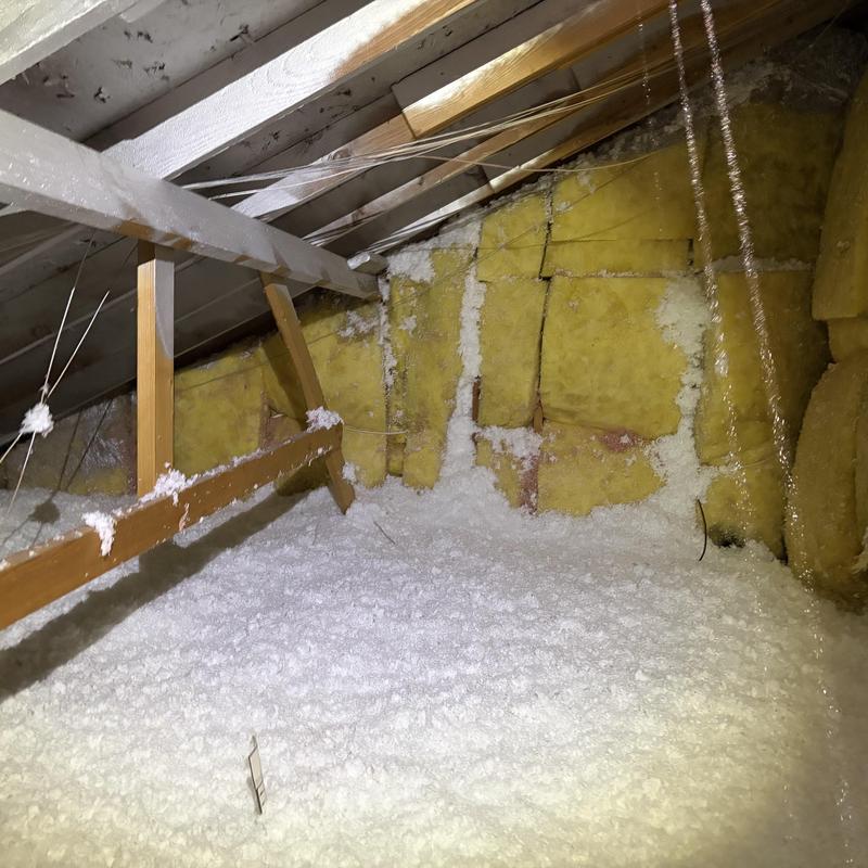 Attic insulation with fiberglass and cellulose layers