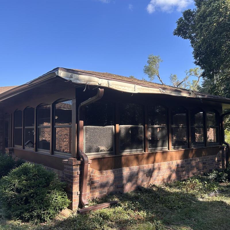 Aluminum gutters on brick sunroom exterior Aluminum gutters on brick sunroom exterior