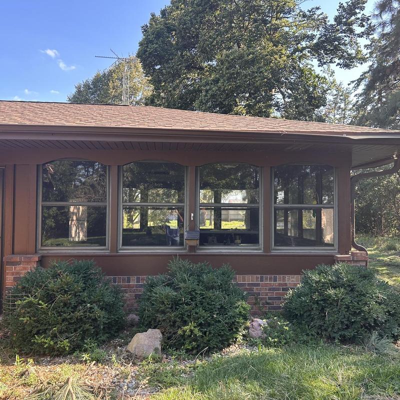 Window frame and exterior wall with brick trim Window frame and exterior wall with brick trim
