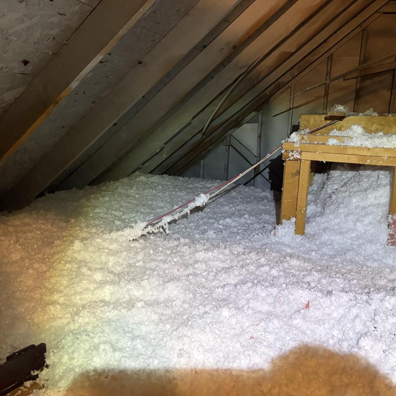 Attic insulation installation with blown-in cellulose in Fort Worth