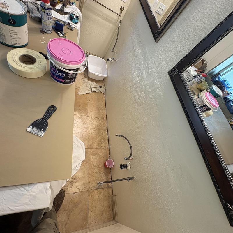 Widespread lavatory faucet plumbing setup in bathroom