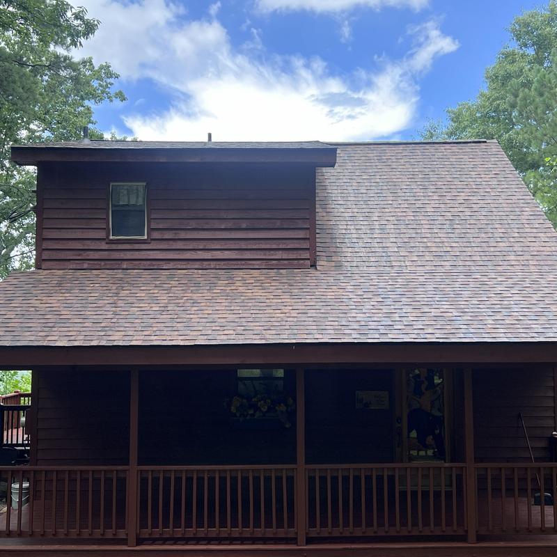 Wood siding and deck with fresh stain and repairs