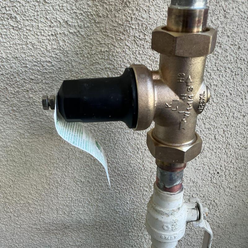 Pressure regulator valve installed on copper piping