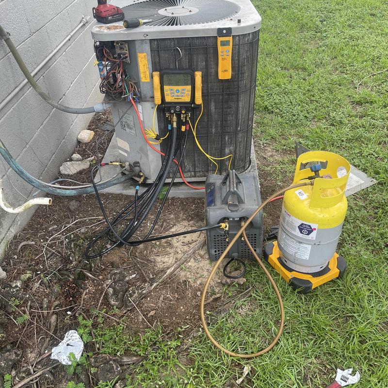 Split system air conditioner with Freon recovery equipment