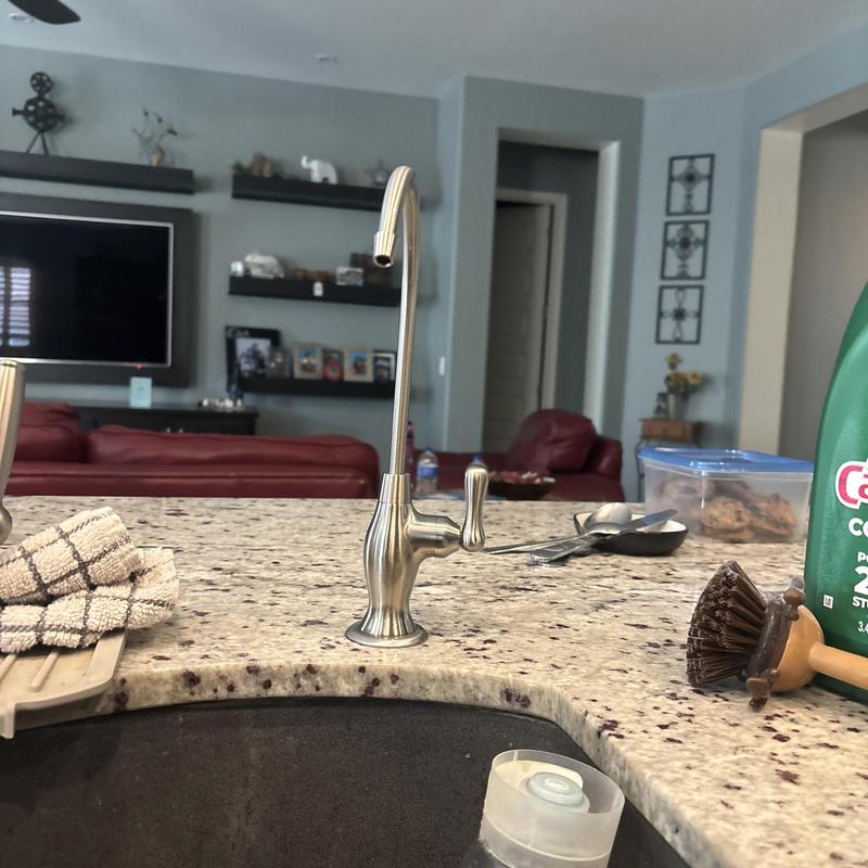 Reverse osmosis faucet on granite countertop in kitchen
