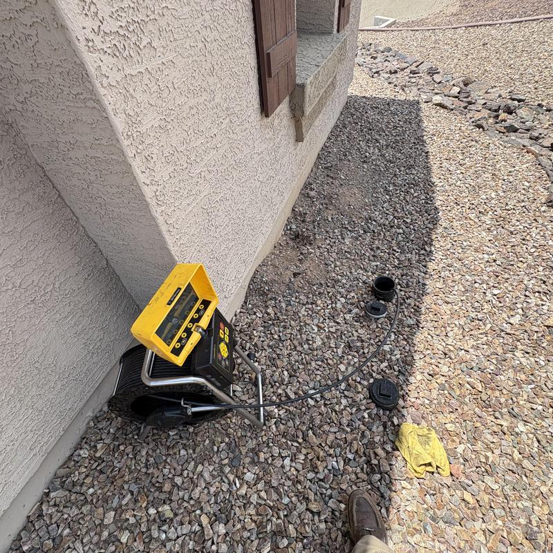 Sewer line inspection camera setup outside house