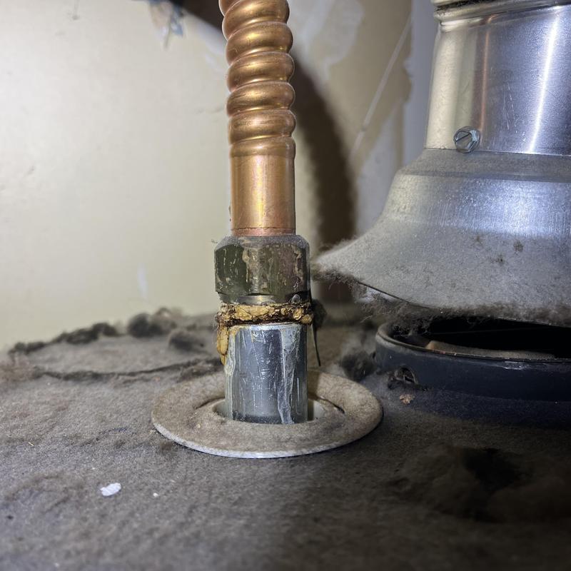 Gas water heater gas line connection with sealant buildup Gas water heater gas line connection with sealant buildup
