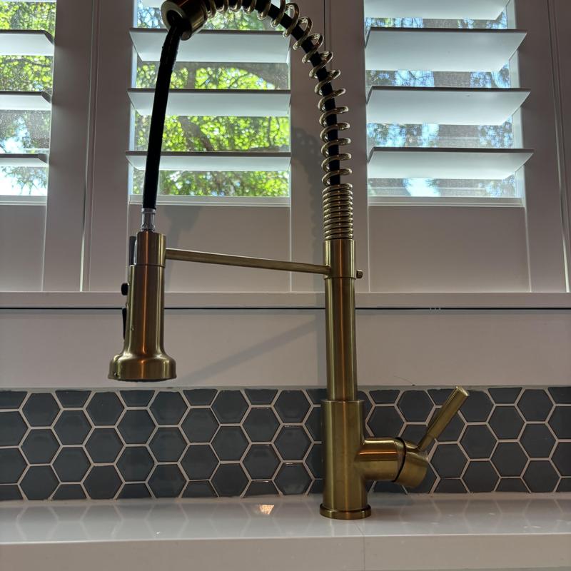 Kitchen faucet with flexible spring spout installed Kitchen faucet with flexible spring spout installed