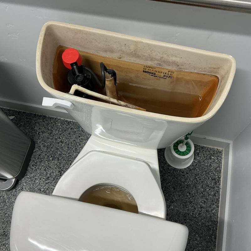 Toilet fill valve with sediment buildup inside tank Toilet fill valve with sediment buildup inside tank