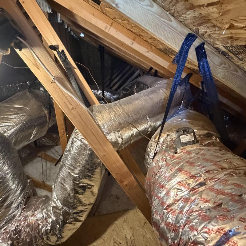 Attic HVAC ductwork insulated and suspended Attic HVAC ductwork insulated and suspended