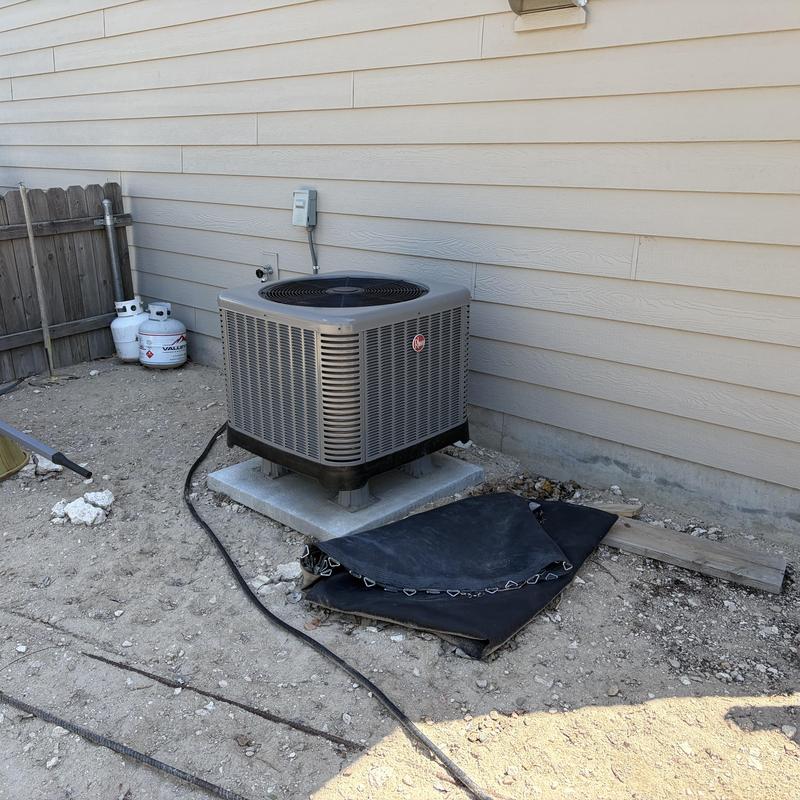Outdoor heat pump unit on concrete pad installation Outdoor heat pump unit on concrete pad installation