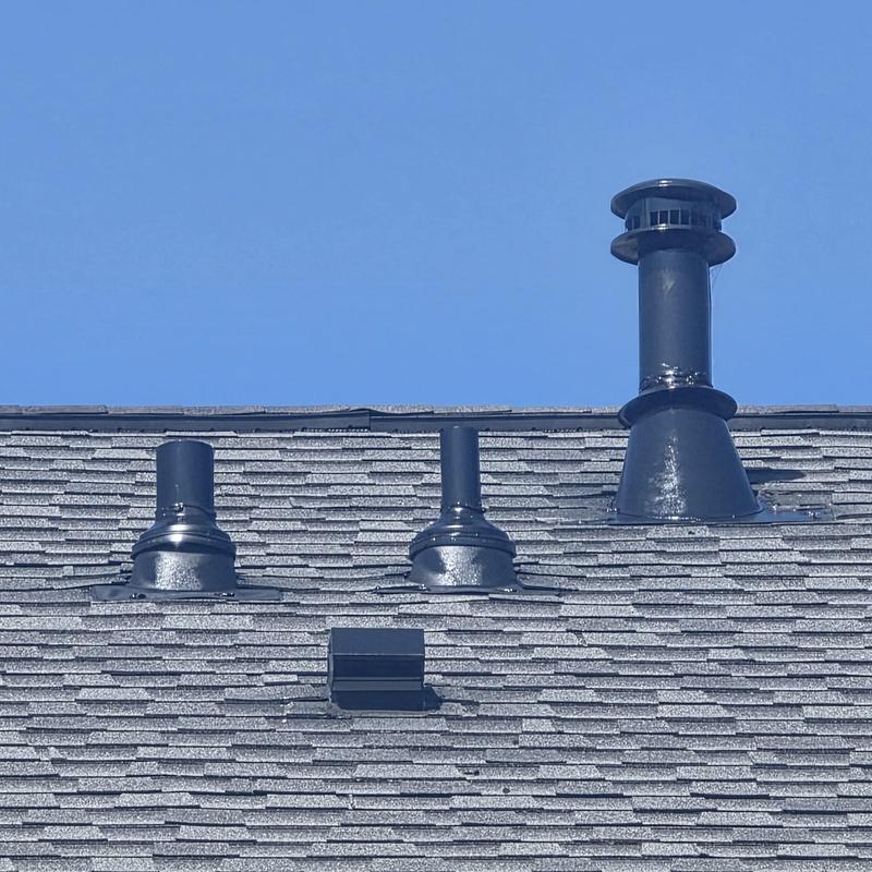 Pipe boots and shingles with secondary rain collars on roof