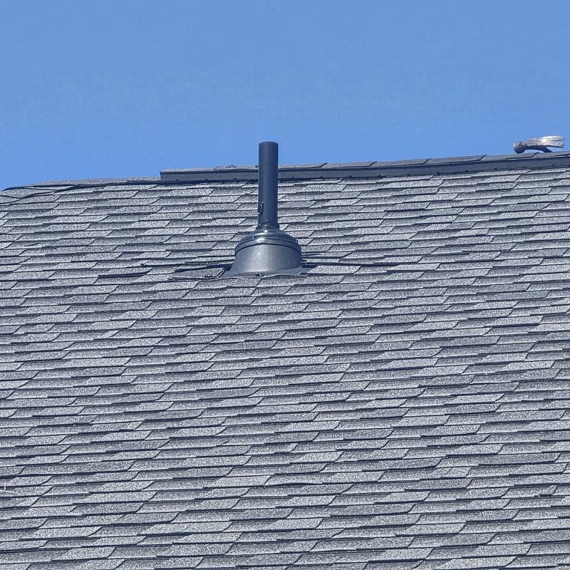Pipe boot with rubber rain collars on shingle roof