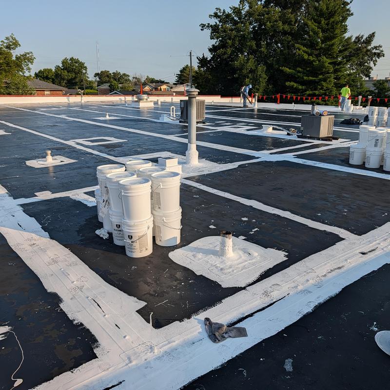 EPDM commercial roof with white seam sealant applied