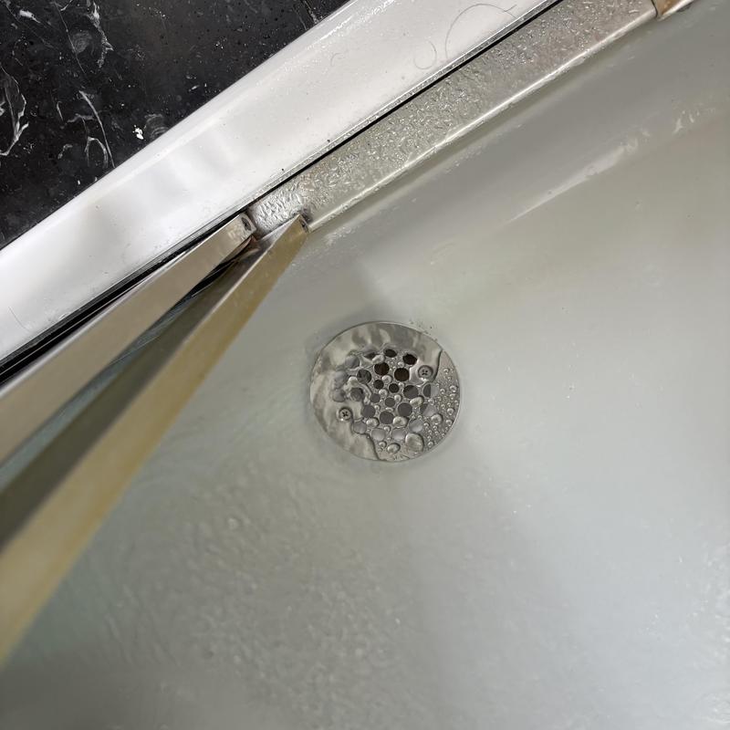 Shower drain with new silicone-sealed strainer