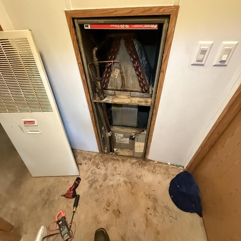 Furnace and coil compartment inspection with tools nearby