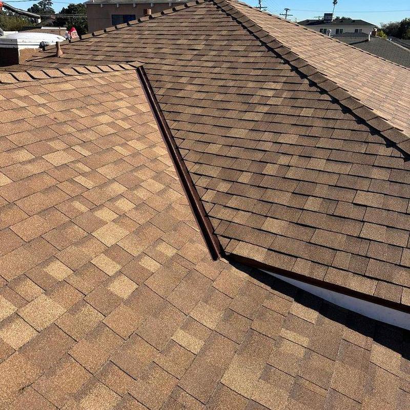 Asphalt shingle roof with metal valley flashing installation Asphalt shingle roof with metal valley flashing installation