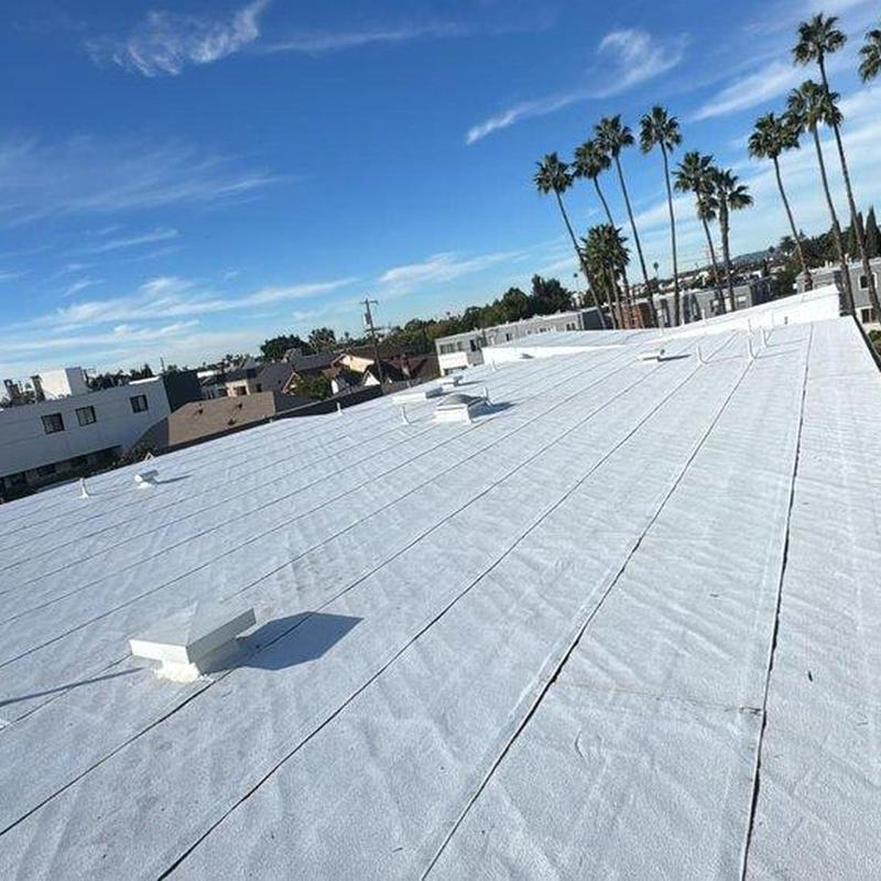 Flat roofing membrane installation on commercial building Flat roofing membrane installation on commercial building