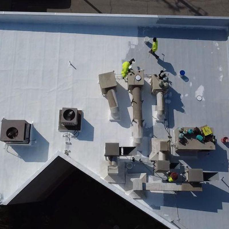 Commercial roof membrane with ventilation system repairs Commercial roof membrane with ventilation system repairs