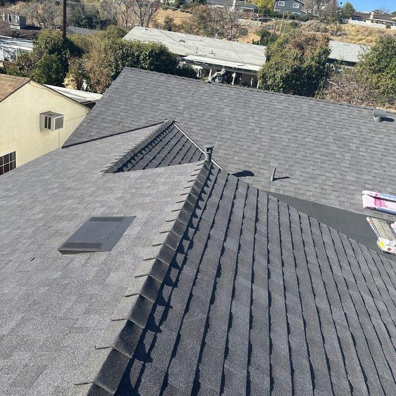 Asphalt shingle roof with ridge ventilation installed Asphalt shingle roof with ridge ventilation installed