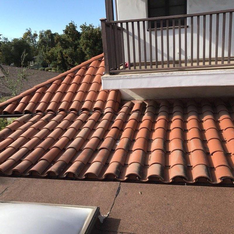 Tile roof section near balcony railing in Rosemead, CA Tile roof section near balcony railing in Rosemead, CA