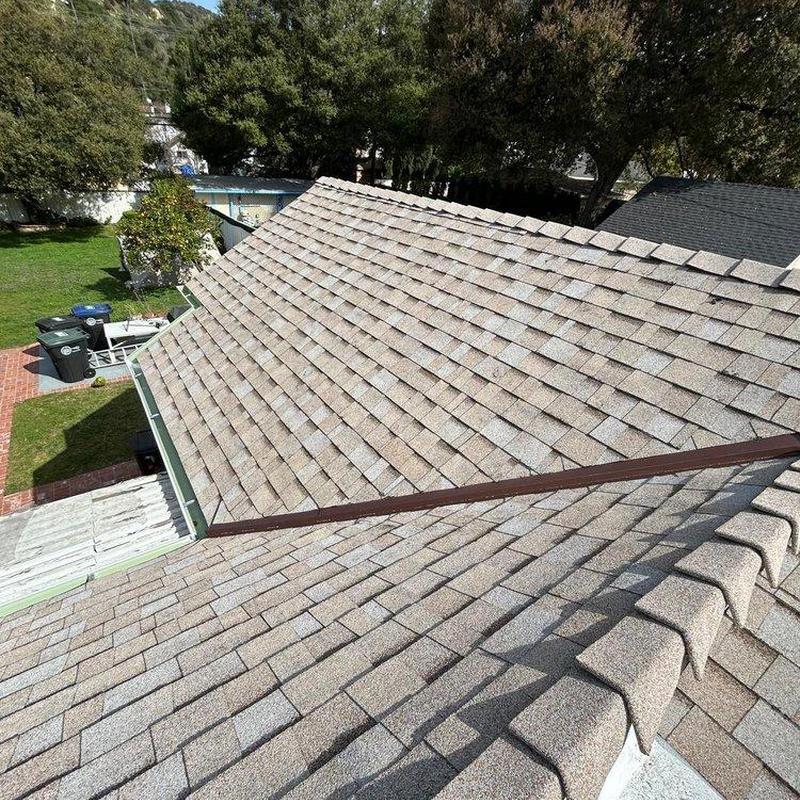 New shingle roof installation on residential house New shingle roof installation on residential house