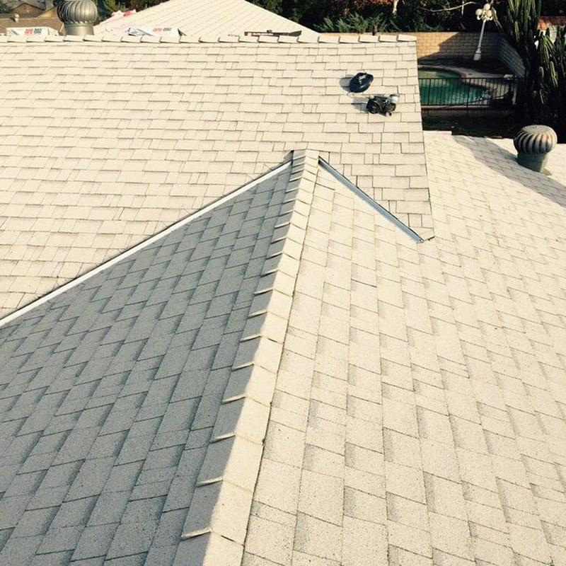 White shingle roof with ridge cap installation White shingle roof with ridge cap installation