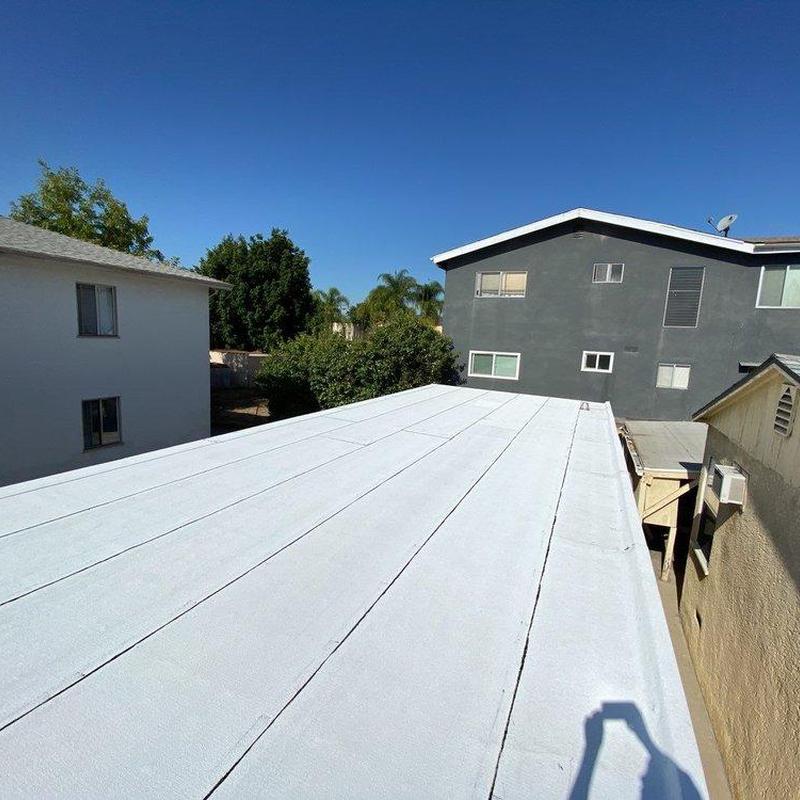 Flat roof membrane installation on residential building Flat roof membrane installation on residential building