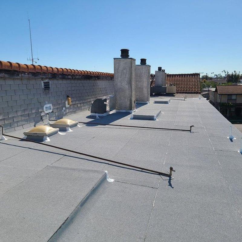 Flat roof with chimney stacks and vents in San Dimas Flat roof with chimney stacks and vents in San Dimas