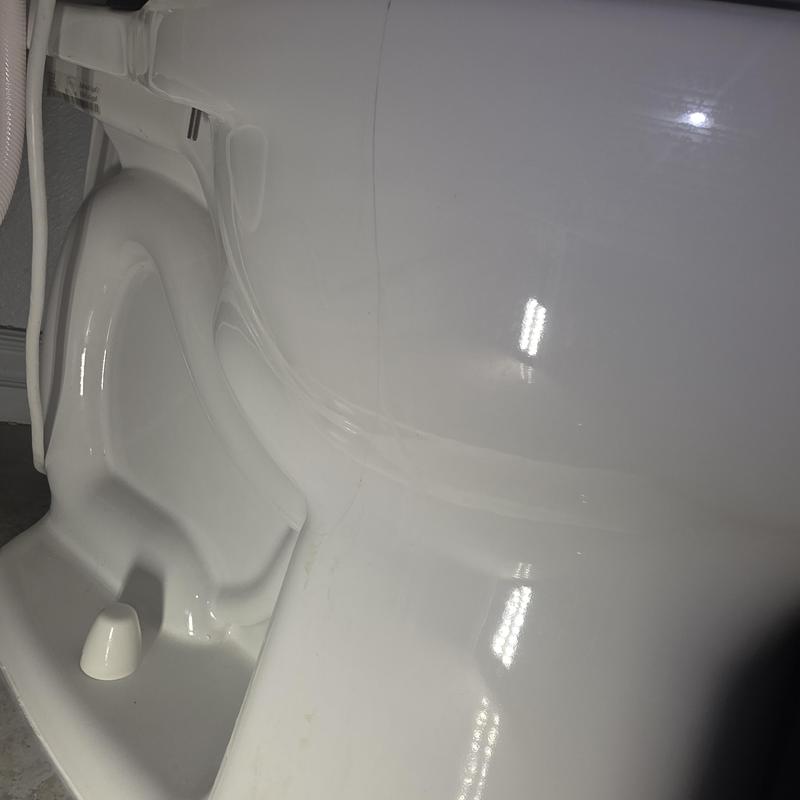 Toilet bowl with visible crack on side Toilet bowl with visible crack on side