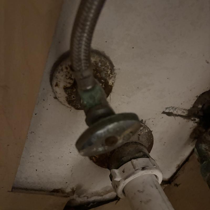 P-trap drain line and supply valve connection under sink