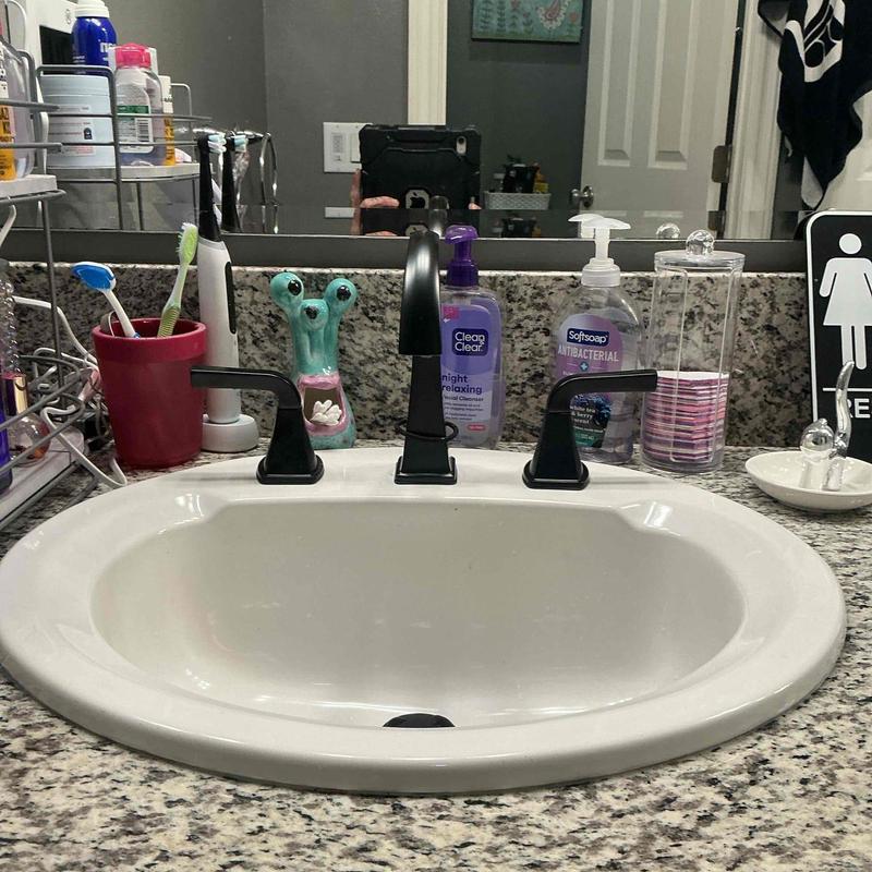 Widespread bathroom faucet installation on sink