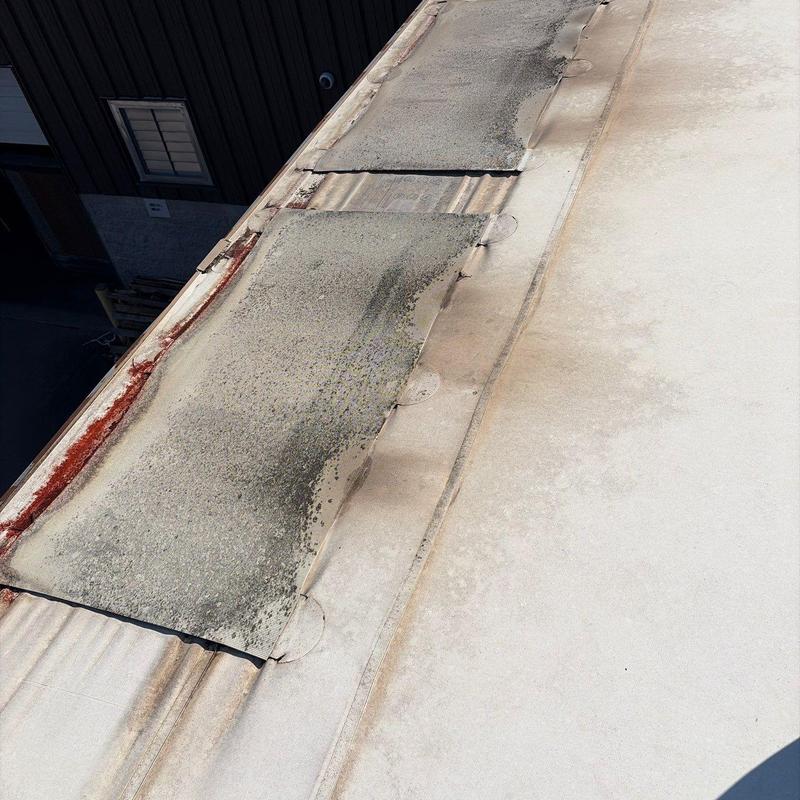 Roof membrane with rust and wear damage details