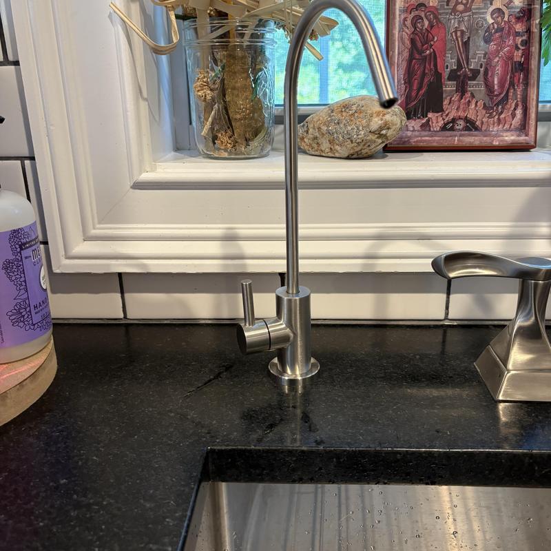 Reverse osmosis faucet installed on kitchen countertop