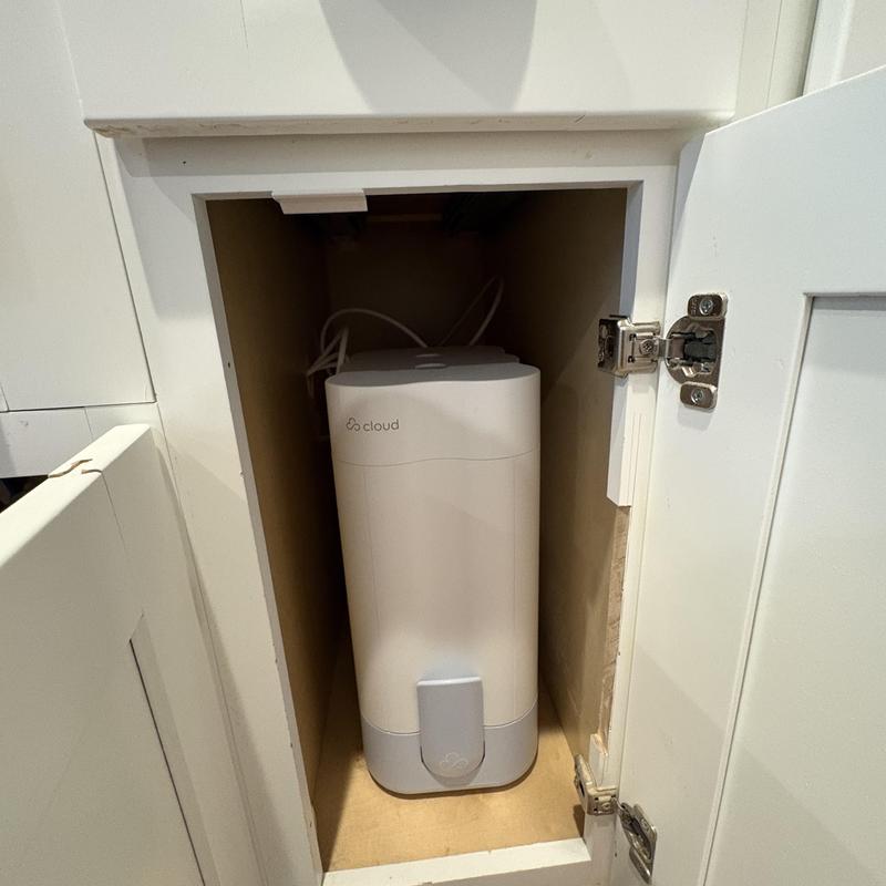 Reverse osmosis filtration system in kitchen cabinet