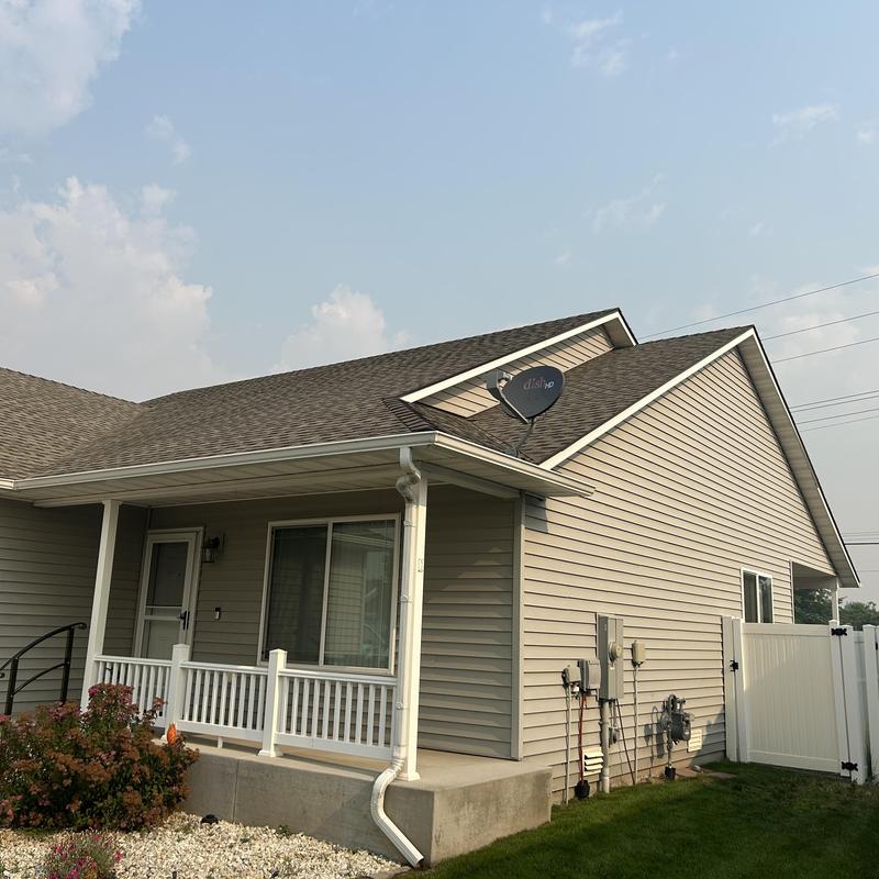 Roof shingles and gutter inspection on house exterior Roof shingles and gutter inspection on house exterior