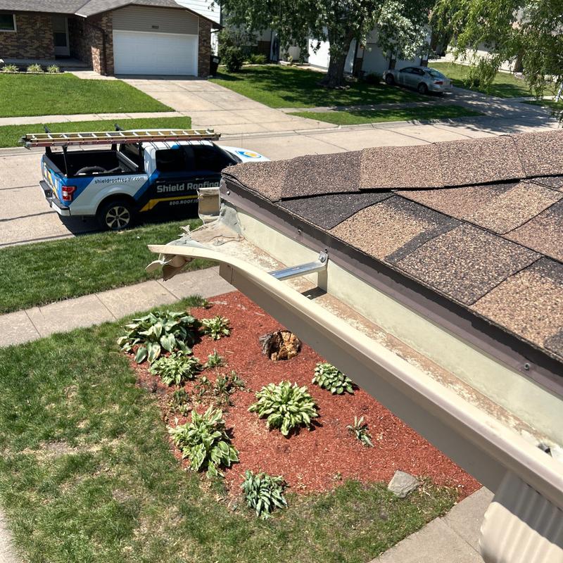Mastic aluminum gutter replacement on house roof edge Mastic aluminum gutter replacement on house roof edge