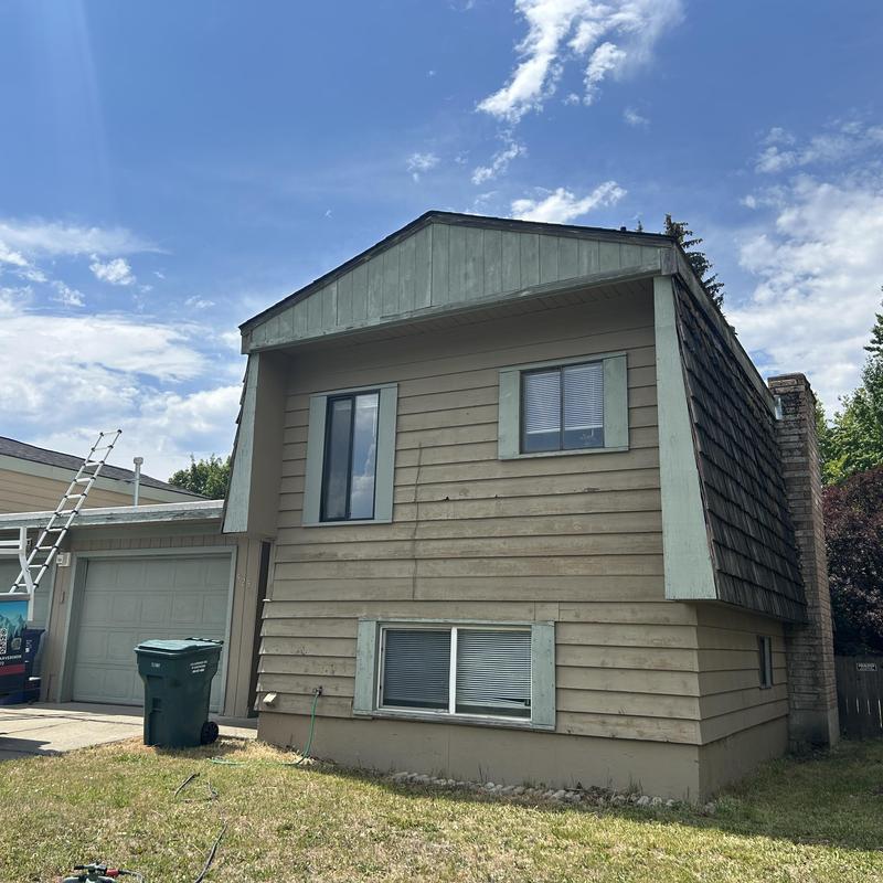 Roof shingles and siding inspection on residential home Roof shingles and siding inspection on residential home