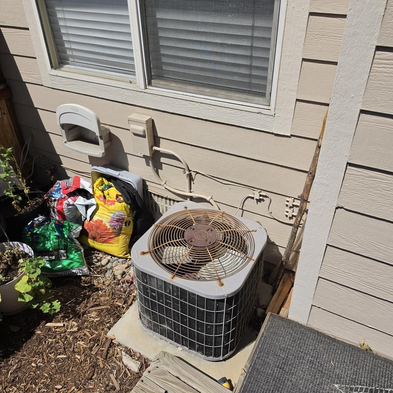 Carrier outdoor air conditioner unit with rusted fan guard